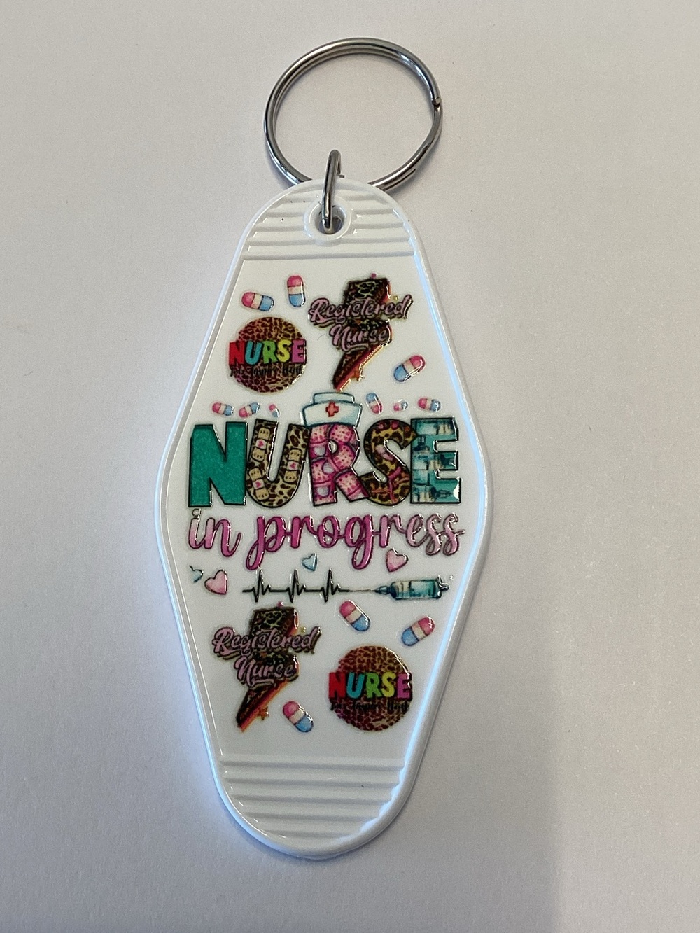 Nurse in Progress Keychain - White with Teal & Pink